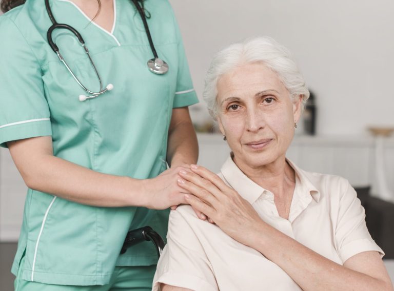 female-nurse-giving-support-senior-woman-sitting-wheel-chair-min female-nurse-giving-support-senior-woman-sitting-wheel-chair-min